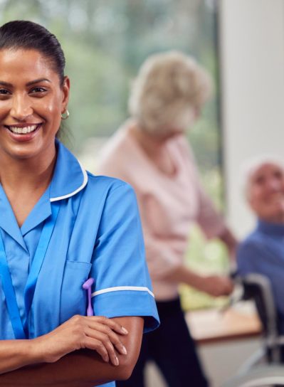 portrait-female-nurse-care-worker-making-home-visit-senior-couple-with-man-wheelchair